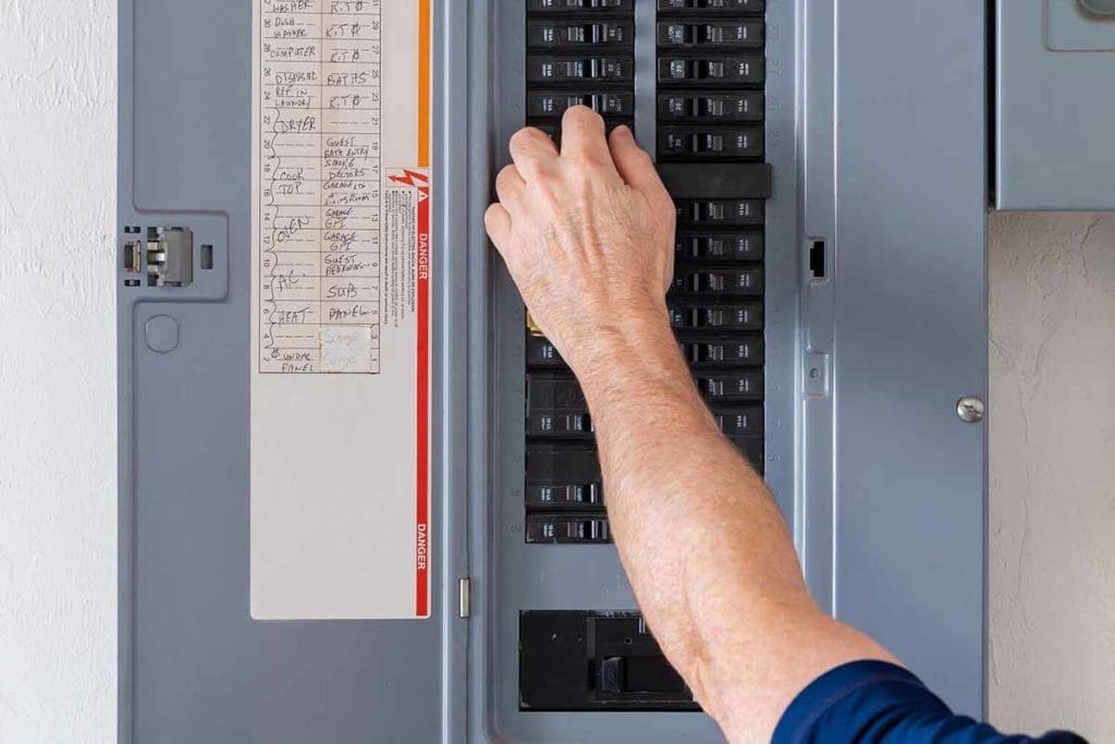person using electrical panel